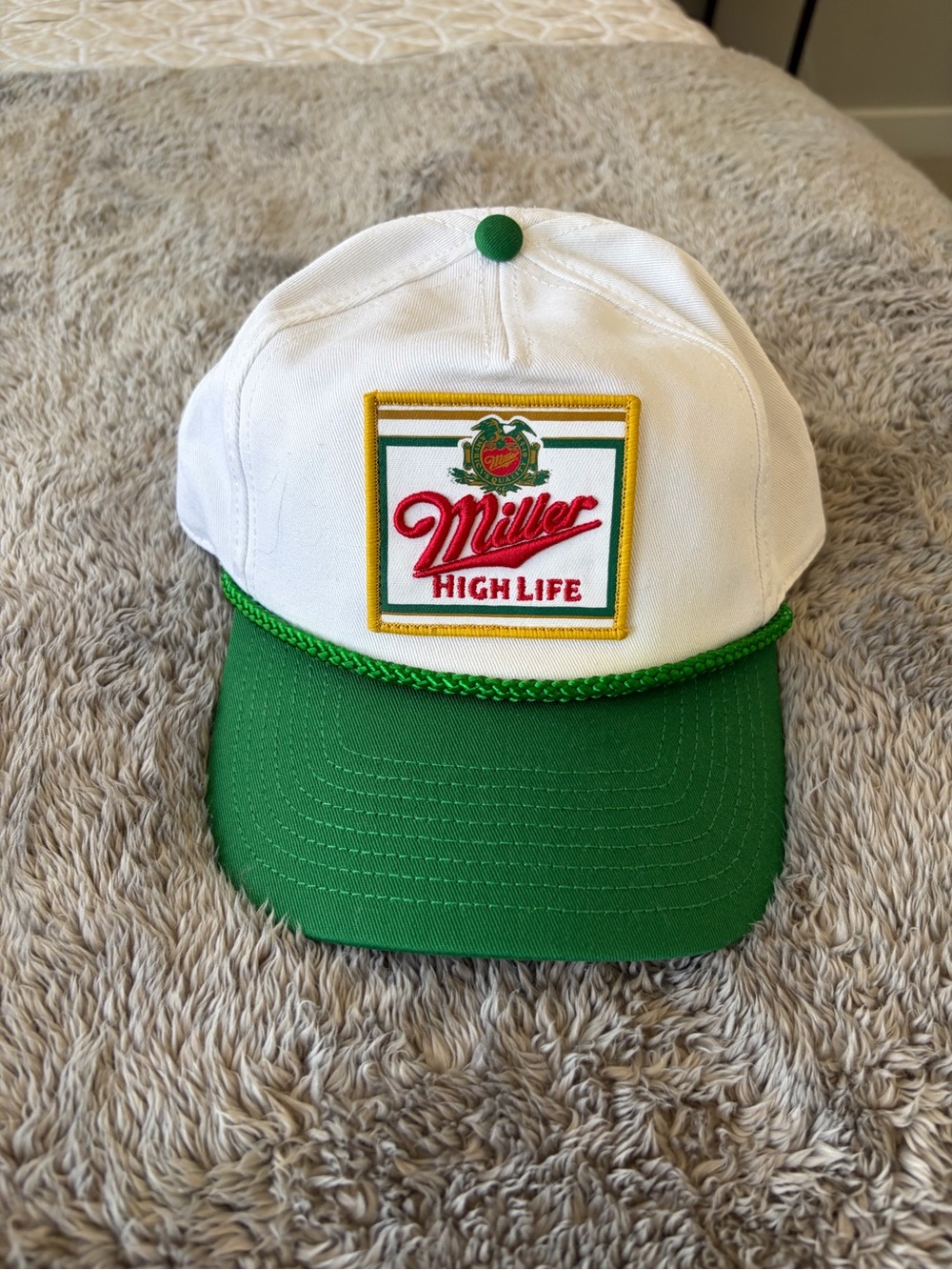 American Needle White and Black Trucker Cap with Red Patch